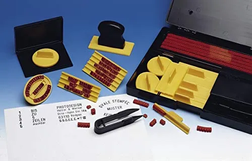 Typendruckerei 323typ - Komplett-Set - Ablagesysteme mit 571 Gummitypen, ideal für individuelle Textstempel. Enthält verschiedene Halter und Zubehör für eine bequeme Handhabung.