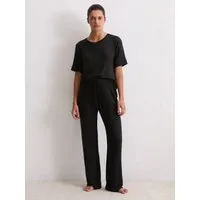 Marc O'Polo Loungehose Soft Knit schwarz XL - Stoffhose aus weichem Modalmix mit seitlichen Taschen und Bindeband für perfekten Tragekomfort – ideal für entspannte Tage.