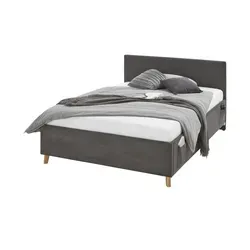 Meise Möbel Polsterbett - Elegantes Polsterbett mit integriertem Bettkasten für zusätzlichen Stauraum und einem robusten eichefarbigen Holzfuß, ideal für eine gemütliche Schlafumgebung.