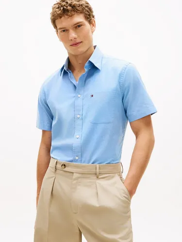 Tommy Hilfiger Herren Light Oxford Solid Ss Bd Mw0mw42285 S/S, Blau, Größe L - Authentisches Tommy Hilfiger Shirt aus leichtem Oxford-Stoff, ideal für lässige Anlässe. Mit geprüfter Qualität und zeitlosem Design.
