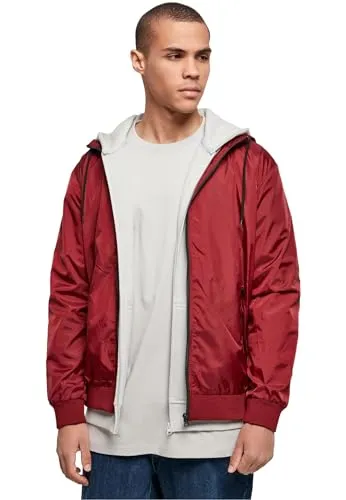 Build Your Brand Windrunner Jacket XL - Funktionale Outdoorjacke aus 100% Nylon, winddicht und ideal für aktive Abenteuer in Burgunder und Schwarz.