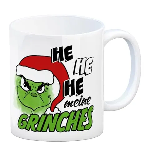 Weihnachtsmuffel Kaffeebecher mit Spruch He he he meine Grinches eine bunte Tasse für die Arbeit grünes grinsendes Gesicht Weihnachtsmann Motiv Weihnachten Kaffeetasse Becher
