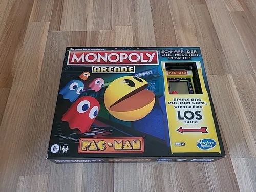 Pac-Man Arcade Brettspiel Monopoly *Deutsche Version* - Gesellschaftsspiel im Pac-Man Design, verbindet klassischen Spielspaß mit nostalgischem Gaming-Erlebnis.