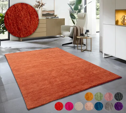 THEKO Wollteppich Holi, handgewebt in terrakotta - Teppich aus 100% reiner Schurwolle, handgewebt für eine warme Wohnatmosphäre, trittschalldämmend und fußbodenheizungsgeeignet.