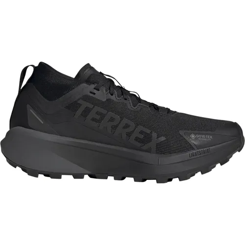 ADIDAS TERREX AGRAVIC GTX TRAILRUNNING Schuh, Gr. 46, schwarz - Wasserdichte Trailrunningschuhe mit GORE-TEX Membran für trockene Füße und optimalen Halt auf nassen Trails. Ideal für lange Strecken und anspruchsvolles Gelände.