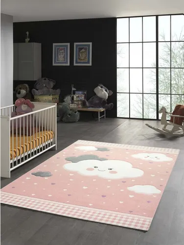 TeppichHome24 Kinderteppich mit Wolken in Rosa, rechteckig - Flachgewebe-Teppich, strapazierfähig und pflegeleicht, ideal für das Kinderzimmer mit fröhlichem 3-D Effekt für Spiel und Spaß.