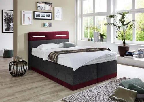 Elegantes Boxspringbett mit LED-Beleuchtung in rot von Westfalia