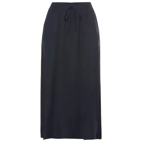 Jack Wolfskin Montero Skirt W - Stilvoller Damenrock in Dunkelblau - Der MONTERO SKIRT W von Jack Wolfskin vereint Komfort und modernes Design. Mit einstellbarem Kordelzug, praktischen Taschen und atmungsaktivem Material ist er ideal für den urbanen Alltag und Freizeitaktivitäten.