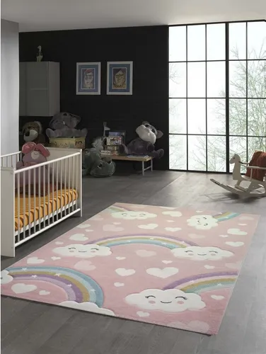 TeppichHome24 Kinderteppich Regenbogen mit Wolken und Herzen - Flachgewebe-Teppich, ideal für das Kinderzimmer – der weiche Teppich begeistert mit bunten Regenbogen-Motiven und ist pflegeleicht sowie allergikerfreundlich.
