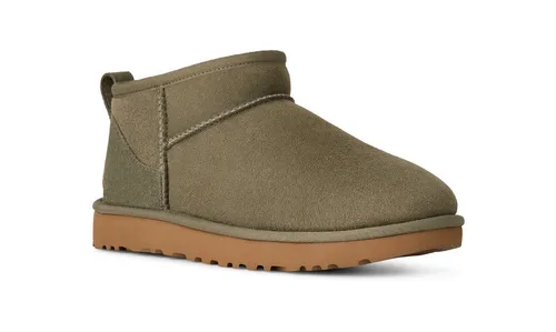 UGG Unisex Classic Ultra Mini Schlupfboots - Stylische Schlupfboots mit kuscheligem Lammfellfutter für warme Füße. Das praktische Design ermöglicht einfaches An- und Ausziehen, während die flexible Gummisohle optimalen Halt bietet. Ideal für kalte Tage!