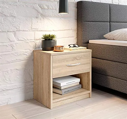 möbelando Nachttisch Nachtkonsole Nako Bettine – Eiche Sonoma - MODERNES DESIGN - Die Nachtkommode besticht durch ihre schlichte Linienführung und fügt sich harmonisch in jedes Schlafzimmer ein. PRAKTISCHER STAURAUM - Mit 39 cm Breite und 41 cm Höhe bietet sie ausreichend Platz für Ihre persönlichen Gegenstände. EINFACHE MONTAGE - Dank der beiliegenden Anleitung ist der Aufbau schnell erledigt.