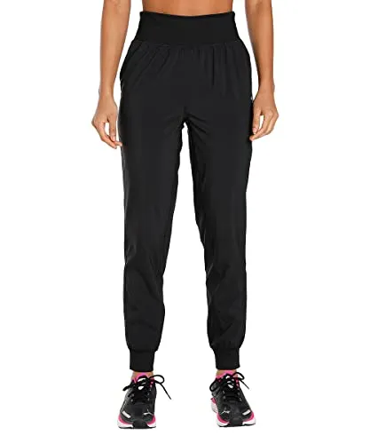 PUMA Damen Run Favorite Tapered Pant W Hose, Schwarz, XL - Hochwertige Sporthose im Tapered Fit, ideal für Läuferinnen mit praktischer Reißverschlusstasche hinten für sichere Aufbewahrung.