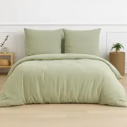 Traumschlaf Musselin Bettwäsche Uni 200x220 cm + 2x 80x80 cm | grün - Genießen Sie erholsamen Schlaf mit unserer hochwertigen Musselin Bettwäsche im Crinkle-Look. Luftig, weich und pflegeleicht – ideal für entspannte Nächte.
