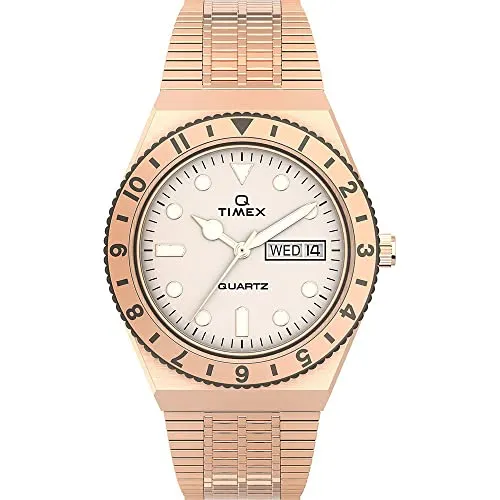 Timex Damen Analog Quarz Armbanduhr Q Reissue - Elegante Armbanduhr für Damen mit roségold Edelstahlarmband, Kalenderfunktion und Leuchtzeigern. Ideal für stilbewusste Frauen, die Wert auf Qualität und Design legen.