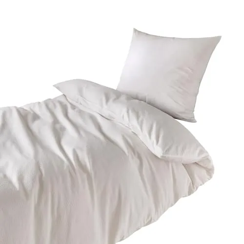 Traumschlaf Seersucker Bettwäsche Uni Weiss, 140x200 cm - Bettwäsche-Set aus luftiger Seersucker Baumwolle, ideal für heiße Sommernächte. Pflegeleicht, bügelfrei und mit Qualitätsreißverschluss für höchsten Komfort.