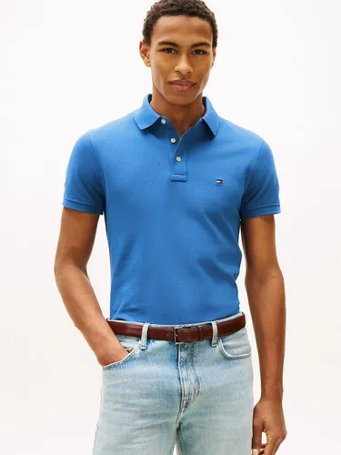 Tommy Hilfiger Poloshirt 1985 SLIM POLO mit Markenstickerei - Stylisches Poloshirt aus hochwertigem Baumwoll-Piqué, ideal für lässige Anlässe. Slim Fit in Blue Orbit mit Knopfverschluss und logobesticktem Design. Pflegeleicht und bequem.