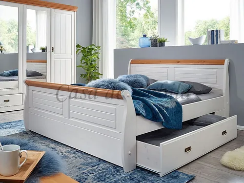 Massivholz Schubladenbett 180x200 Kiefer in Weiß-Honig - Doppelbett im Landhausstil mit praktischen Schubladen, ideal für zusätzlichen Stauraum im Schlafzimmer. Hergestellt aus massivem Kiefernholz, bietet es nicht nur Komfort, sondern auch Langlebigkeit.