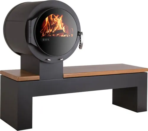 Kaminofen Kanuk® BANK Nussbaum hell - Schwarz mit Sitzbank - Kaminofen und Sitzgelegenheit in einem. Der Kanuk® BANK bietet 8 kW Leistung für bis zu 200 m³ und überzeugt mit effizienter Brenntechnologie und individuellem Design durch verschiedene Holzvarianten.