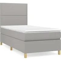 vidaXL Boxspringbett mit Matratze Hellgrau 90x190 cm - Bequemes Boxspringbett für erholsame Nächte! Mit höhenverstellbarem Kopfteil, atmungsaktivem Stoff und mittlerer Unterstützung für optimalen Schlafkomfort.