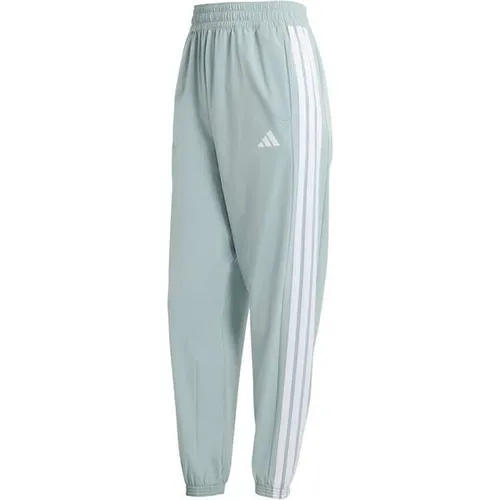 adidas Women's Train Essentials 3-Stripes Woven Pants - Wonder Sage/White, Größe L - Sportliche Damenhose mit mittelhohem Bund, aus recyceltem Polyester. Feuchtigkeitsableitend für optimalen Tragekomfort beim Training.