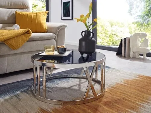 möbelando Couchtisch Glas Ø 60 cm - Eleganter Wohnzimmertisch in Silber - Beistelltisch fürs Wohnzimmer mit robustem, elegantem Design. Tischplatte aus transparentem Glas und lackiertem Edelstahlgestell, ideal für stilvolle Wohnräume.