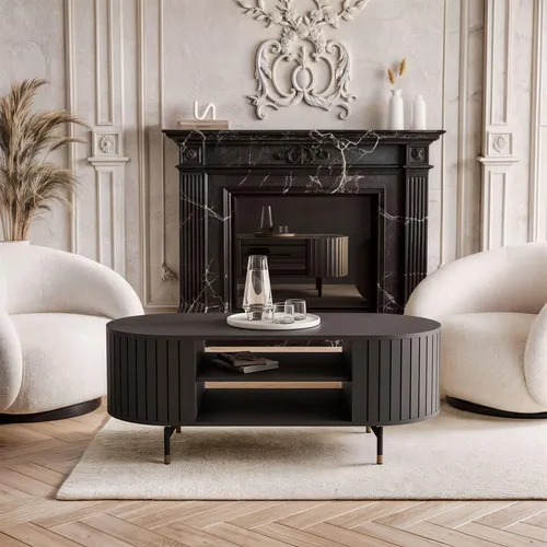 Couchtisch LINNEA Oval 104 cm – Schwarz Matt mit Goldenen Füßen - Eleganter ovaler Couchtisch LINNEA in Schwarz Matt (104 cm) mit praktischer Ablage. Perfekt für stilvolle Wohnzimmer, bietet er Platz für Deko und sorgt für Ordnung.