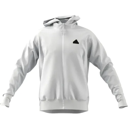 adidas Trainingsjacke Z.N.E. Woven Zip-Hoodie für Damen in Weiß - Sportbekleidung aus 88% recyceltem Polyester, feuchtigkeitsabsorbierend mit AEROREADY Technologie für trockenen Tragekomfort. Ideal für Abenteuer und mit praktischen Taschen.