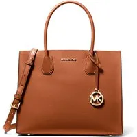 Michael Kors Braune Fell-Handtasche - Elegante Damentasche von Michael Kors aus hochwertigem Fell. Mit kompakten Maßen von 32x25x14 cm ist sie der perfekte Begleiter für jeden Anlass.