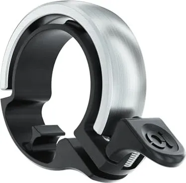 Knog Oi Classic Fahrradklingel (10219449) – Stilvolle Sicherheit - Die Knog Oi Classic Fahrradklingel (10219449) kombiniert modernes Design mit klarer Klangqualität. Ideal für Radfahrer, die Wert auf Stil und Funktionalität legen.
