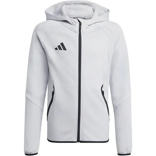 Adidas Tiro Travel Sweat Hoodie - grau - Der Adidas Tiro Travel Sweat Hoodie für Kinder vereint Komfort und Style. Mit elastischen Bündchen und einer praktischen Reißverschlusstasche ist er ideal für Freizeitaktivitäten. Perfekt für kleine Trendsetter!