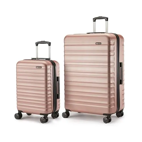 Amazon Basics Hartschalen-Koffer-Set, 2 Stück - Gepäck-Set mit erweiterbarem Design für bis zu 25% mehr Volumen; kratzfeste ABS-Schale und 4 Rollen sorgen für mühelosen Transport in stilvollem Roségold.