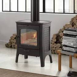 Hergom E20 Kaminofen Gusseisen Schwarz - Kaminofen aus Gusseisen mit integrierter Scheibenspülung für klare Sicht auf das Flammenspiel und platzsparendem oberen Rauchrohranschluss. Ideal für gemütliche Abende.