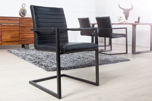 riess-ambiente Freischwinger LOFT antik schwarz - Freischwinger im angesagten Bauhausstil, mit hochwertigem Kunstlederbezug und gepolsterten Armlehnen für optimalen Sitzkomfort.