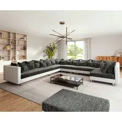 DELIFE Wohnlandschaft Clovis XXL Weiß Schwarz mit Hocker - Ecksofa mit modularem Design für individuelle Anpassung, inklusive 32 Kissen für maximalen Komfort. Ideal für geräumige Wohnzimmer und entspannte Stunden.