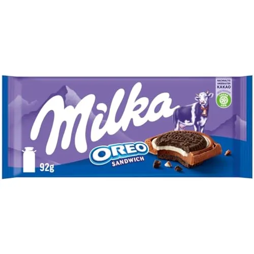 Milka Oreo Sandwich – Alpenmilch-Schokolade mit Oreo-Keks-Stückchen - Sortimentpackungen für Pralinen mit zarter Alpenmilch-Schokolade, gefüllt mit knusprigen Oreo-Stückchen und feiner Vanillecrème – ideal zum Teilen und Genießen.