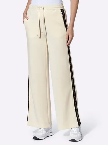 heine Jerseyhose mit Galonstreifen - Stilvolle Jerseyhose mit kontrastfarbenen Galonstreifen. Bequemer Rundum-Dehnbund und modisches weites Bein mit Seitenschlitzen für optimalen Tragekomfort.