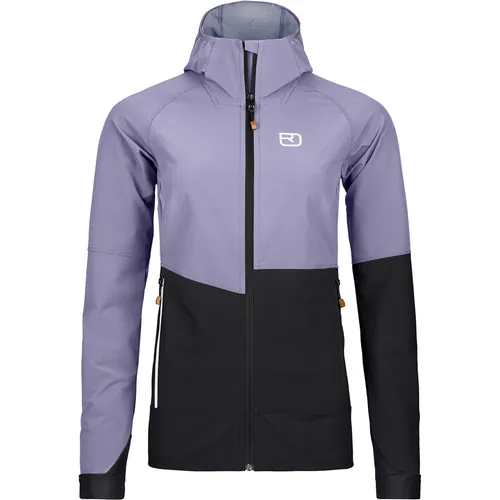 Ortovox Punta Berrino Hooded Jacket Women – Funktionale Softshelljacke - Die PUNTA BERRINO HOODED JACKET vereint Leichtigkeit und Funktionalität. Ideal für Skitouren bietet sie Atmungsaktivität, Robustheit sowie Wind- und Wasserabweissung – perfekt für aktive Outdoor-Abenteuer.