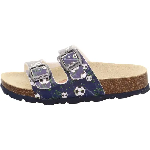 Superfit Jungen FUSSBETTPANTOFFEL Hausschuhe, BLAU/MEHRFARBIG 8110 - Hausschuhe für Jungen mit orthopädischem Tieffußbett aus Naturkork und anpassbarer Weite durch 2 Schnallen, ideal für breitere Füße.