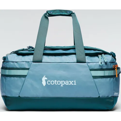Cotopaxi Allpa Getaway 55L Duffel - Robuste 55L Duffel-Tasche aus recyceltem Nylon für Outdoor-Abenteuer. Mit abnehmbaren Rucksackgurten und praktischem Packwürfel bietet sie Vielseitigkeit und Komfort beim Reisen.