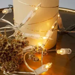 Lichterkette innen 10 klare warme Lichter, beleuchtet 1,35m, Kabel klar, Stecker - Transparent