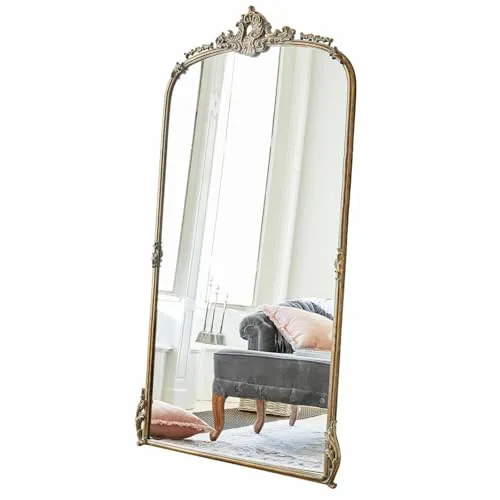 Loberon Spiegel Choni - Antiker Wandspiegel mit Ornamentverzierungen - Eleganter Wandspiegel im antiken Look, verziert mit üppigen Ornamenten. Ein stilvolles Wohn-Accessoire aus Eisen und Polyresin, das jedem Raum einen Hauch von Nostalgie verleiht.