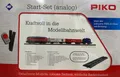 Produktbild: PIKO 57154 BR 218, H0 DC Start-Set Güterzug, DB Cargo mit Bettung