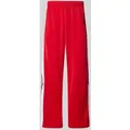 Produktbild: adidas Originals Trainingshose mit seitlichen Druckknöpfen und elastischem Bund in Rot, Größe XL