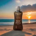 Produktbild: Hawaiian Tropic Glowing Protection SPF 30 Trockenes Öl - Spray. Tropischen Duft