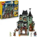 Produktbild: LEGO Creator Geisterhaus 3-in-1-Spielzeug  - Spielzeughaus verwandelt sich in ein Geisterschiff oder einen LEGO Zug  - Baumodell mit 5 Minifiguren ... - Bronze