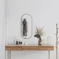 Produktbild: vidaXL Wandspiegel Schwarz 80x35 cm Oval