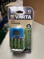 Produktbild: Varta Ladegerät LCD Charger mit USB und 12 V Adapter inclusive 4 Foto Akku AA