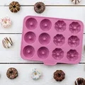 Produktbild: Backform 12 Mini-Donuts Rund und Blumenform Happy Baking Silikon 25 cm Zenker