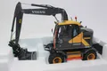Produktbild: AT Collection 3200100 Volvo EWR 150 E Mobilbagger 1:32 Nokian Reifen NEU OVP