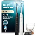Produktbild: Philips Sonicare DiamondClean 9000 elektrische Zahnbürste, Schallzahnbürste mit App, Andruckkontrolle, 4 Putzmodi, 3 Intensitätsstufen, Ladeglas, Schwarz und Roségold, Zweierpack, Modell HX9914/57